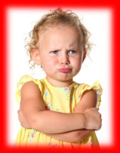 Image of a pouting little girl with her arms crossed